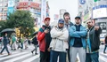 Фоновый кадр с франшизы Люди просто ничего не делают: Успех в Японии